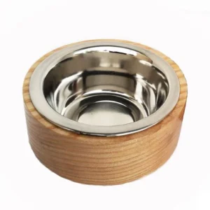 A bowl with a metal rim on top of it.