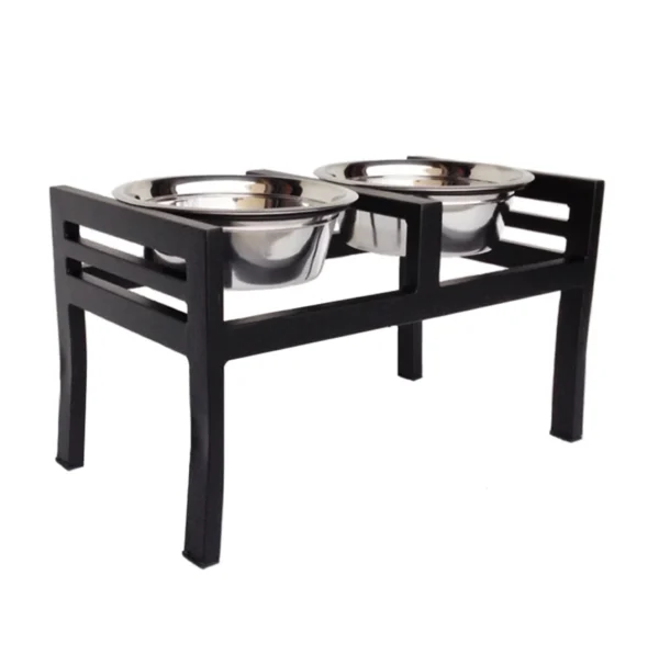 A black table with two stainless steel bowls on top.