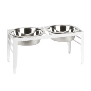 A white elevated dog bowl stand with two stainless steel bowls.